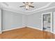 Spacious bedroom featuring hardwood floors, decorative wall molding, and a ceiling fan at 3541 Roswell Ne Rd # 21, Atlanta, GA 30305