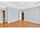 Bedroom with ensuite bath featuring hardwood floors and neutral walls at 3541 Roswell Ne Rd # 21, Atlanta, GA 30305