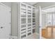 Custom closet features built-in storage and glass-front cabinets at 3541 Roswell Ne Rd # 21, Atlanta, GA 30305