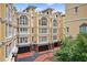 Close exterior view of the building showing detailed architecture, shuttered windows and private garages for each unit at 3541 Roswell Ne Rd # 21, Atlanta, GA 30305