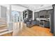 Open-concept kitchen and living room area featuring stainless steel appliances and a grand arched window at 3541 Roswell Ne Rd # 21, Atlanta, GA 30305