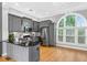 Bright, modern kitchen with stainless steel appliances, granite countertops, and a decorative chandelier at 3541 Roswell Ne Rd # 21, Atlanta, GA 30305