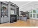 Spacious open concept with a fireplace, built-in shelving, and modern kitchen with stainless steel appliances at 3541 Roswell Ne Rd # 21, Atlanta, GA 30305