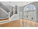 Bright living area with hardwood floors, modern windows, and a staircase at 3541 Roswell Ne Rd # 21, Atlanta, GA 30305