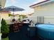 Relaxing rooftop patio area featuring a dining set, hot tub, lounging area and string lights at 3541 Roswell Ne Rd # 21, Atlanta, GA 30305