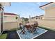 An open-air rooftop patio area with a dining set, decorative rug and string lights at 3541 Roswell Ne Rd # 21, Atlanta, GA 30305