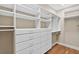 Spacious walk-in closet with custom shelving and drawer units at 3541 Roswell Ne Rd # 21, Atlanta, GA 30305