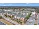 Aerial view of a multi-story brick apartment complex with parking, trees, and road nearby at 1850 Cotillion Dr # 3305, Dunwoody, GA 30338