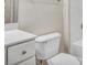 Clean bathroom featuring white fixtures including a toilet, tub, and vanity at 1850 Cotillion Dr # 3305, Dunwoody, GA 30338