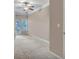 Bright, spacious bedroom with neutral carpet and balcony access providing natural light at 1850 Cotillion Dr # 3305, Dunwoody, GA 30338