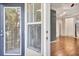 Inviting living room featuring hardwood floors and sunlit windows with bright neutral paint at 1850 Cotillion Dr # 3305, Dunwoody, GA 30338