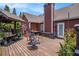 Large wooden deck with outdoor seating and plants at 1951 Chambers Rd, Mcdonough, GA 30253