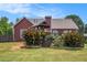 Landscaped backyard with wooden fence and greenery at 1951 Chambers Rd, Mcdonough, GA 30253