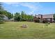 Expansive backyard with fire pit and manicured lawn at 1951 Chambers Rd, Mcdonough, GA 30253