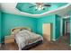 Spacious bedroom offers a tray ceiling, cozy carpet, and ample room for furniture, creating a comfortable personal space at 1951 Chambers Rd, Mcdonough, GA 30253