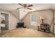 Cozy bedroom with sloped ceiling and desk by window at 1951 Chambers Rd, Mcdonough, GA 30253