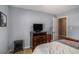 Spacious bedroom featuring a television, dresser, and a door to another room at 1951 Chambers Rd, Mcdonough, GA 30253