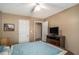 Bedroom featuring a TV on a dresser, a ceiling fan, and a doorway leading to another room at 1951 Chambers Rd, Mcdonough, GA 30253