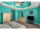 Cozy bedroom with a clock and flat-screen TV offering a relaxing and entertaining space for the occupant at 1951 Chambers Rd, Mcdonough, GA 30253