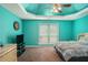 Serene bedroom features tray ceilings, a ceiling fan, and natural light, providing a comfortable and relaxing retreat at 1951 Chambers Rd, Mcdonough, GA 30253