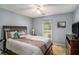 Cozy bedroom featuring a comfortable bed, soft lighting, and neutral wall colors for a relaxing ambiance at 1951 Chambers Rd, Mcdonough, GA 30253