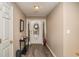 Entryway features wood floors, a console table, and a decorative front door at 1951 Chambers Rd, Mcdonough, GA 30253