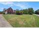 Landscaped front yard and two-story home with driveway at 1951 Chambers Rd, Mcdonough, GA 30253