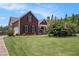 Well-maintained front yard showcases a beautiful, two-story home with a side-entry garage at 1951 Chambers Rd, Mcdonough, GA 30253