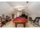 Spacious game room featuring a pool table, seating, and entertainment center at 1951 Chambers Rd, Mcdonough, GA 30253