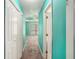 Hallway leading to a bedroom with tray ceilings, creating an inviting and accessible path to comfort at 1951 Chambers Rd, Mcdonough, GA 30253
