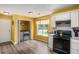 Well-lit kitchen offers an open layout, modern appliances, and convenient access to laundry, blending functionality and style at 1951 Chambers Rd, Mcdonough, GA 30253