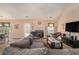 Cozy living room featuring a fireplace, comfortable seating, and lots of natural light at 1951 Chambers Rd, Mcdonough, GA 30253