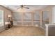 Open loft area with neutral walls, a white railing, and natural light from the windows at 1951 Chambers Rd, Mcdonough, GA 30253