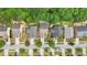 Home neighborhood aerial view of road frontage, driveways, and green landscape at 4546 Water Mill Dr, Buford, GA 30519