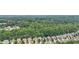 Beautiful aerial view of neighborhood homes backed by lush green trees at 4546 Water Mill Dr, Buford, GA 30519