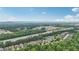 Home aerial view with distant mountain view, expressway, community pool and tennis at 4546 Water Mill Dr, Buford, GA 30519