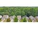 Aerial view of homes nestled among lush greenery and trees at 4546 Water Mill Dr, Buford, GA 30519