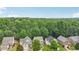 Scenic aerial view of homes in the community with a backdrop of lush greenery at 4546 Water Mill Dr, Buford, GA 30519