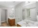 This Primary bathroom has dual sinks, mirrors, and lighting fixtures at 4546 Water Mill Dr, Buford, GA 30519