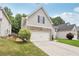 Charming home featuring a two-car garage and stone accents along the front elevation at 4546 Water Mill Dr, Buford, GA 30519