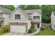 Two-story home with stone accents, garage, and landscaped front yard at 4546 Water Mill Dr, Buford, GA 30519