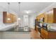Spacious kitchen with an island, granite counters, and wooden cabinets at 4546 Water Mill Dr, Buford, GA 30519