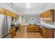 Modern kitchen with stainless steel appliances, granite countertops, and rich wood cabinetry at 4546 Water Mill Dr, Buford, GA 30519