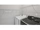 Functional laundry room with shelving and modern washer and dryer at 4546 Water Mill Dr, Buford, GA 30519