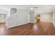 Bright and open living room with hardwood floors, neutral paint, and stairs leading to the upper level at 4546 Water Mill Dr, Buford, GA 30519