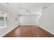 Well-lit living space with hardwood floors, neutral walls, and ample natural light through large windows at 4546 Water Mill Dr, Buford, GA 30519