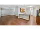 Open-concept living space featuring a kitchen island, warm wood cabinetry, and a spacious seating area at 4546 Water Mill Dr, Buford, GA 30519