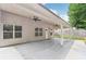Back patio with ceiling fans overlooking the fenced backyard at 4546 Water Mill Dr, Buford, GA 30519