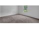 Bedroom featuring neutral carpet, freshly painted walls and a sunlit window at 5653 Bradley Cir, Lithonia, GA 30038