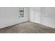 The bedroom boasts plush carpeting, natural light, and ample closet space at 5653 Bradley Cir, Lithonia, GA 30038